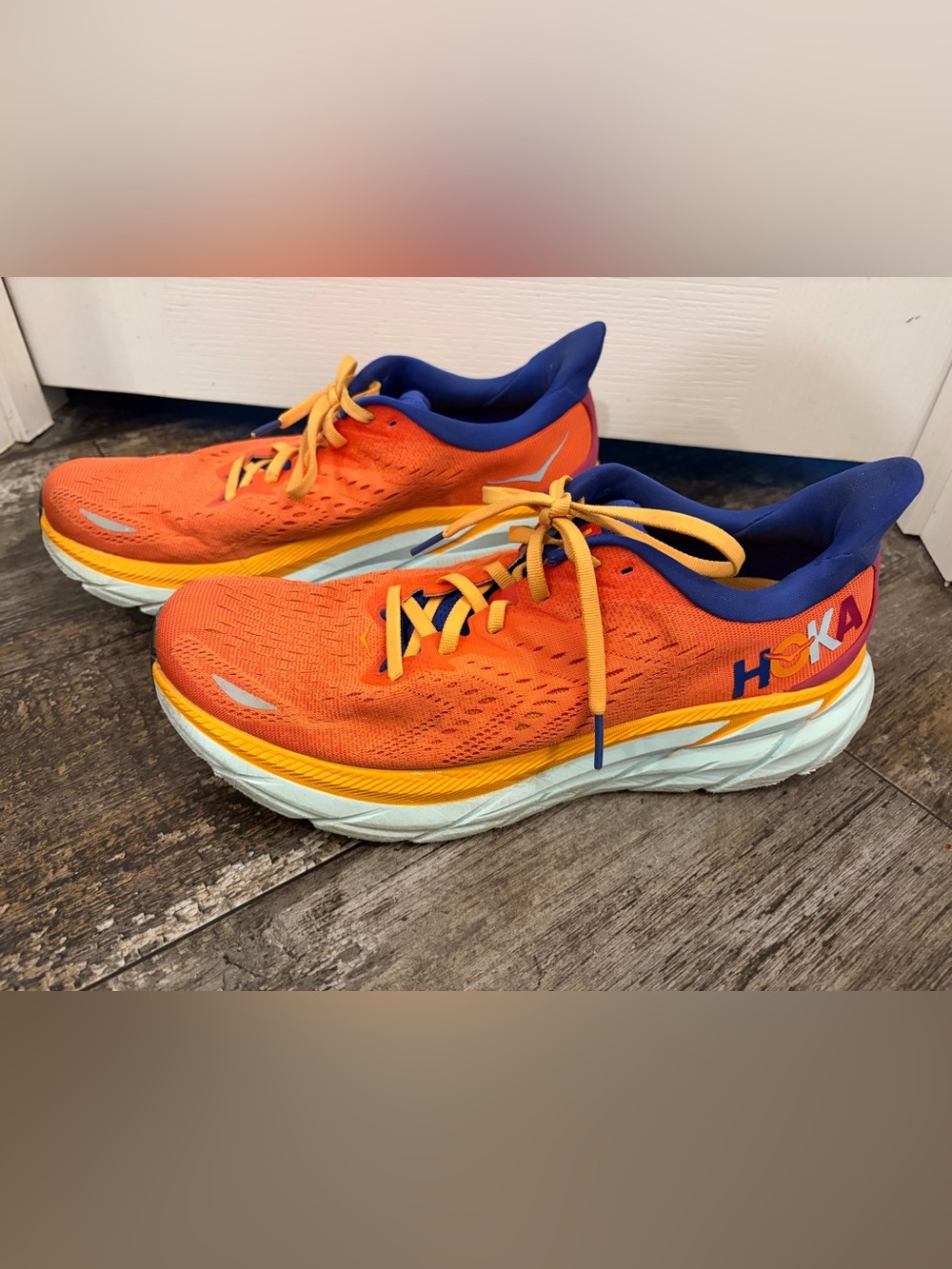 Hoka Orange with Blue Collar and Yellow Accents Running Shoes